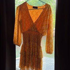 Worn once! The brand is blue rain. Yellow long sleeve spring dress
